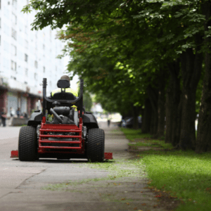 guy riding lawn mower at commercial place